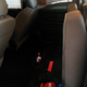 The back seat folded up, with space underneath where I usually keep my hitch, tow straps, and other emergency items.